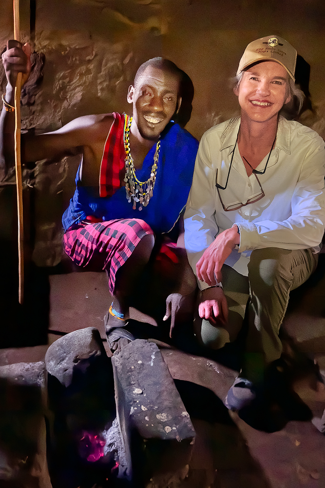 Author and travel writer Sheri Williams inside the mud home of her Maasai warrior friend in Kenya, Africa.
